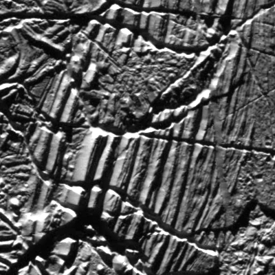This view of Jupiter’s moon Europa was captured in the 1990s by NASA’s Galileo spacecraft. It shows the kind of features studied by scientists who modeled how moonquakes may trigger landslides. The smooth slopes and nearby rubble may have been produced by landslides.