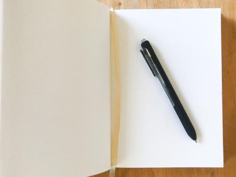 image of blank piece of journal paper and pen