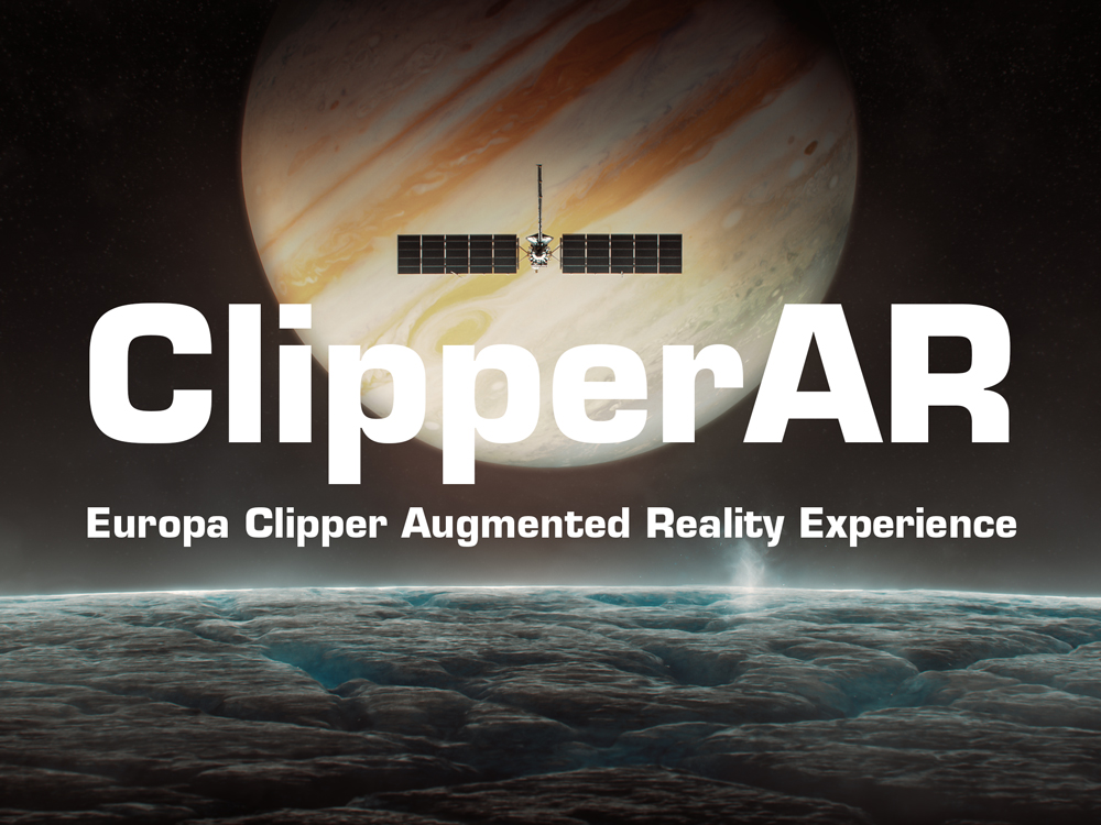 The banner shows the surface of Europa taking up the lower third of the image, icy white and blue, with a small white plume erupting on the right side. Jupiter is visible looming in space behind it, at an angle so that Jupiter's bands are extending from the lower left of the planet to the upper right. The Europa Clipper spacecraft is visible in silhouette in front of Jupiter, flying over Europa. Text is overlaid on the image that says "ClipperAR: Europa Clipper Augmented Reality Experience" 
