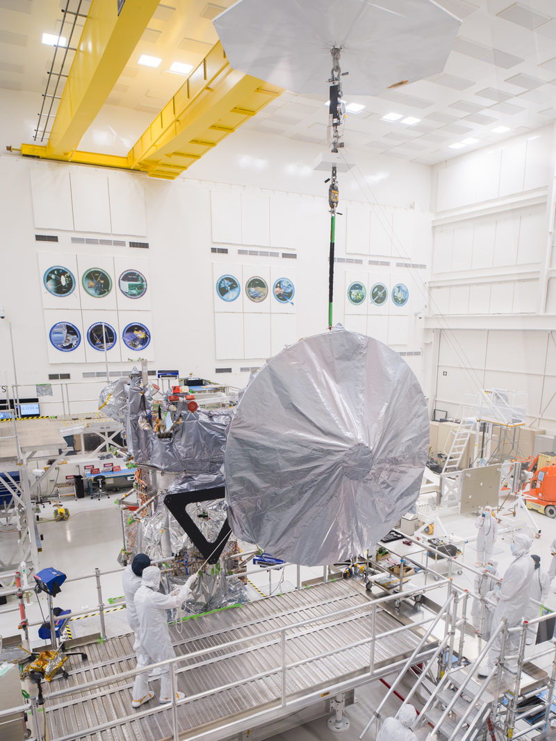 Engineers and technicians use a crane to lift a 10-foot (3-meter) high-gain antenna as they prepare to install it on NASA’s Europa Clipper spacecraft on Aug. 14, 2023. The orbiter is being assembled in the clean room of High Bay 1 at the agency’s Jet Propulsion Laboratory in Southern California in preparation for its launch to Jupiter’s moon Europa in October 2024. The precision-engineered dish was attached to the spacecraft in carefully choreographed stages over the course of several hours. Europa Clipper will need the huge antenna to transmit data hundreds of millions of miles back to Earth. Scientists believe the icy moon Europa harbors a vast internal ocean that may have conditions suitable for supporting life. The spacecraft will fly by the moon about 50 times while its science instruments gather data on the moon’s atmosphere, surface, and interior – information that will help scientists learn more about the ocean, the ice crust, and potential plumes that may be venting subsurface water into space. 