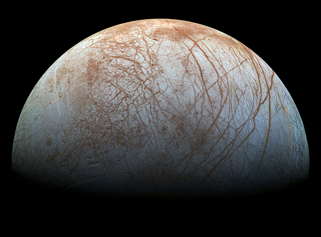 Image of Europa, with darkness surounding it. 