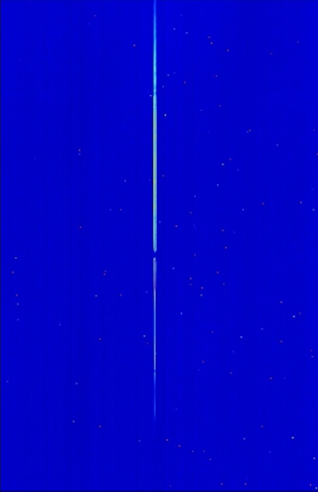 A blue image with a thin vertical white line in the center.