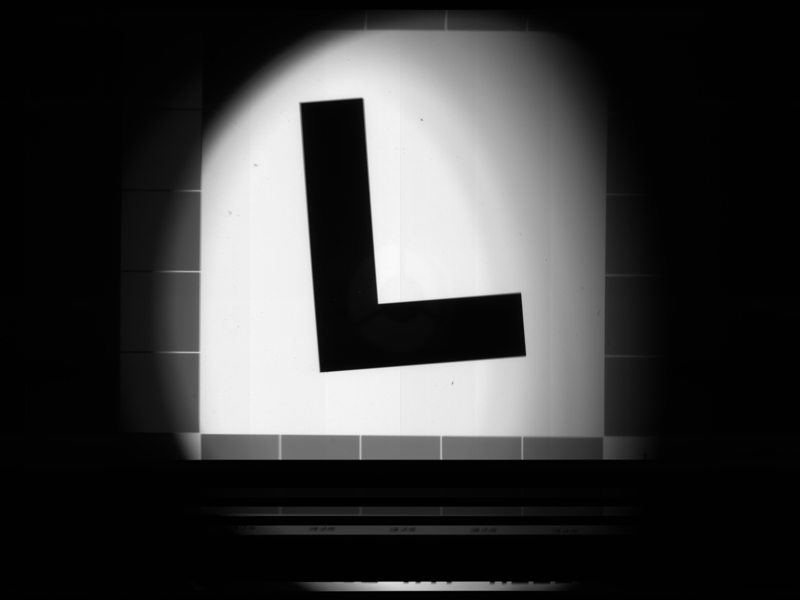 A test pattern in the shape of an L, with stripes at the bottom that show color filters.