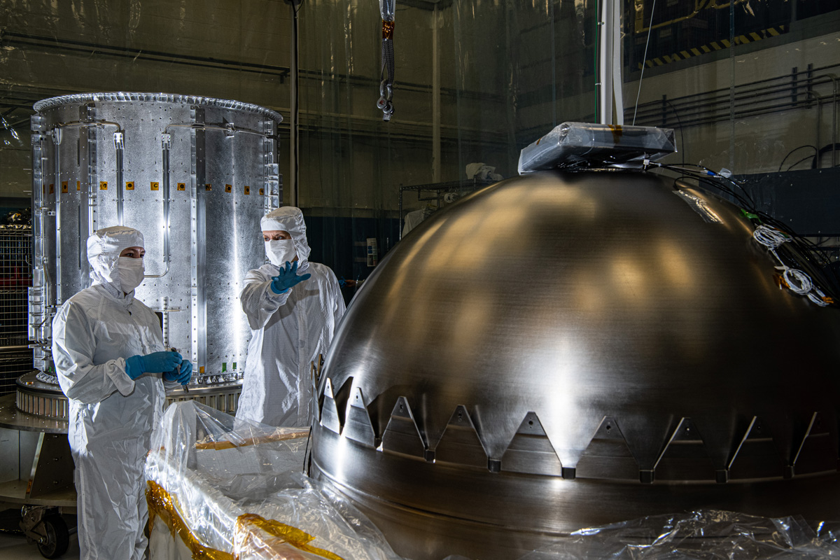 Contamination control engineers in a clean room at NASA's Goddard Space Flight Center in Greenbelt, Maryland, evaluate a propellant tank before it is installed in NASA's Europa Clipper spacecraft.
