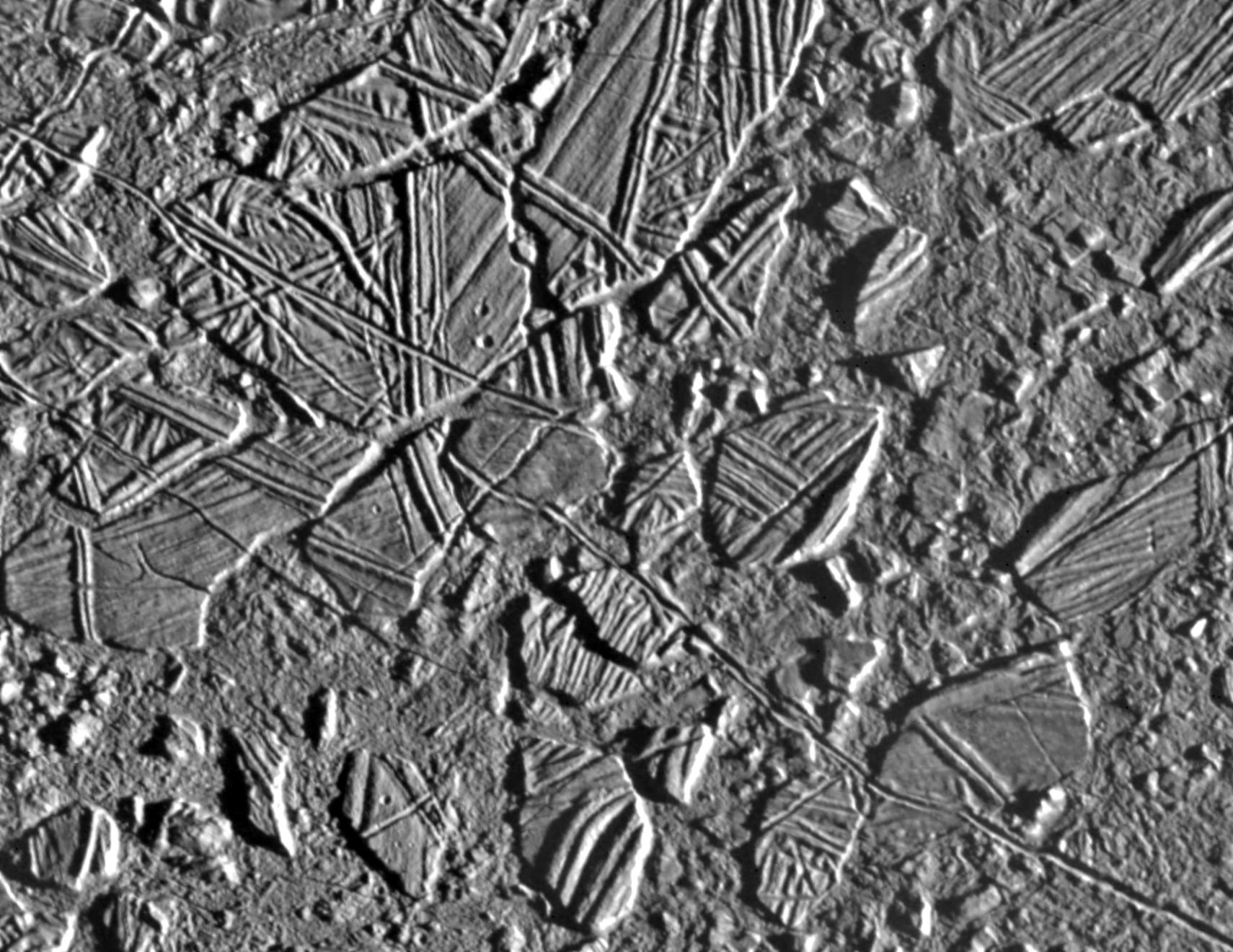 black and white view of rough terrain on an icy surface