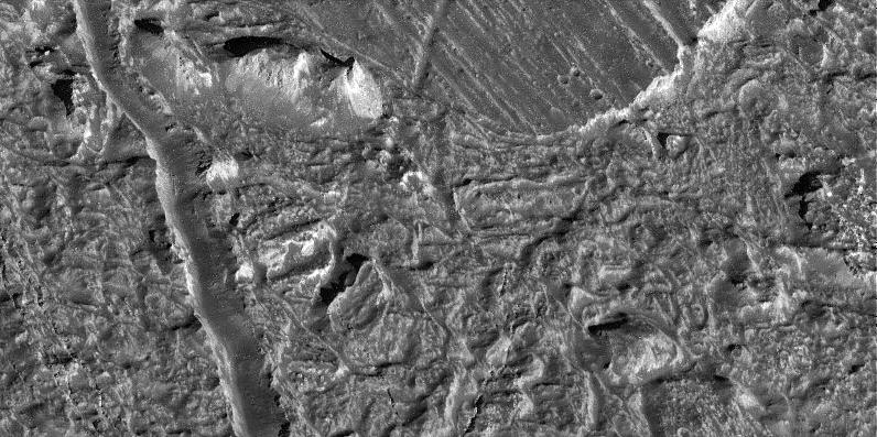 black and white view of rough terrain on an icy surface