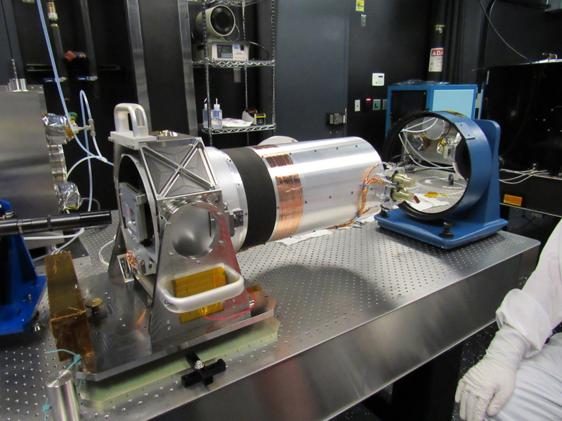 An engineer performs wavefront tests on the optical telescope assembly for the Europa Imaging System narrow angle camera.