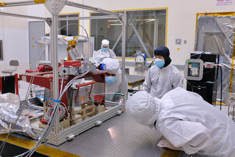 Engineers inspect Europa Clipper's ultraviolet spectrograph in a cleanroom at NASA's Jet Propulsion Laboratory in Southern California.
