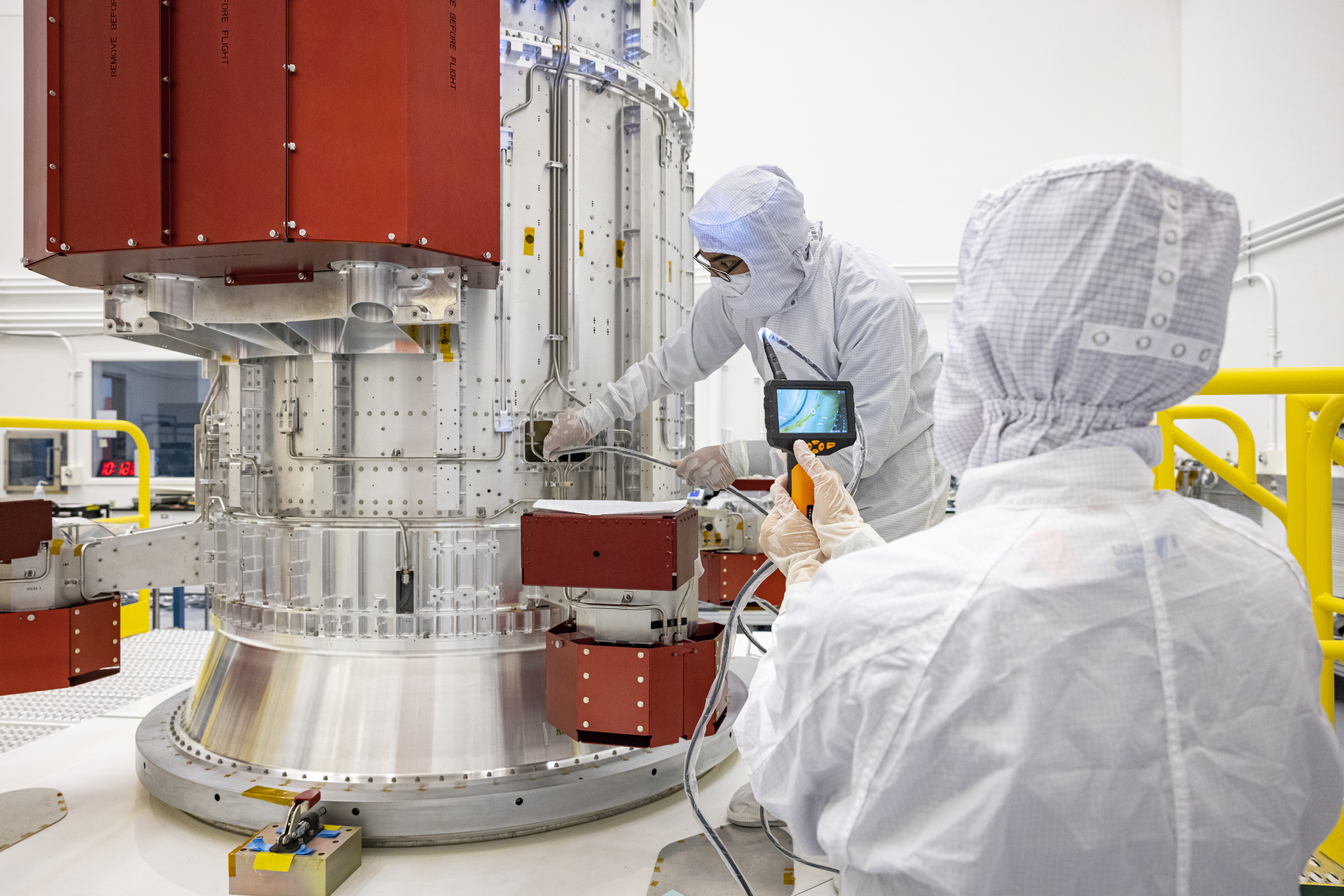 Engineers inspect Europa Clipper's propulsion module in the Johns Hopkins Applied Physics Laboratory clean room.