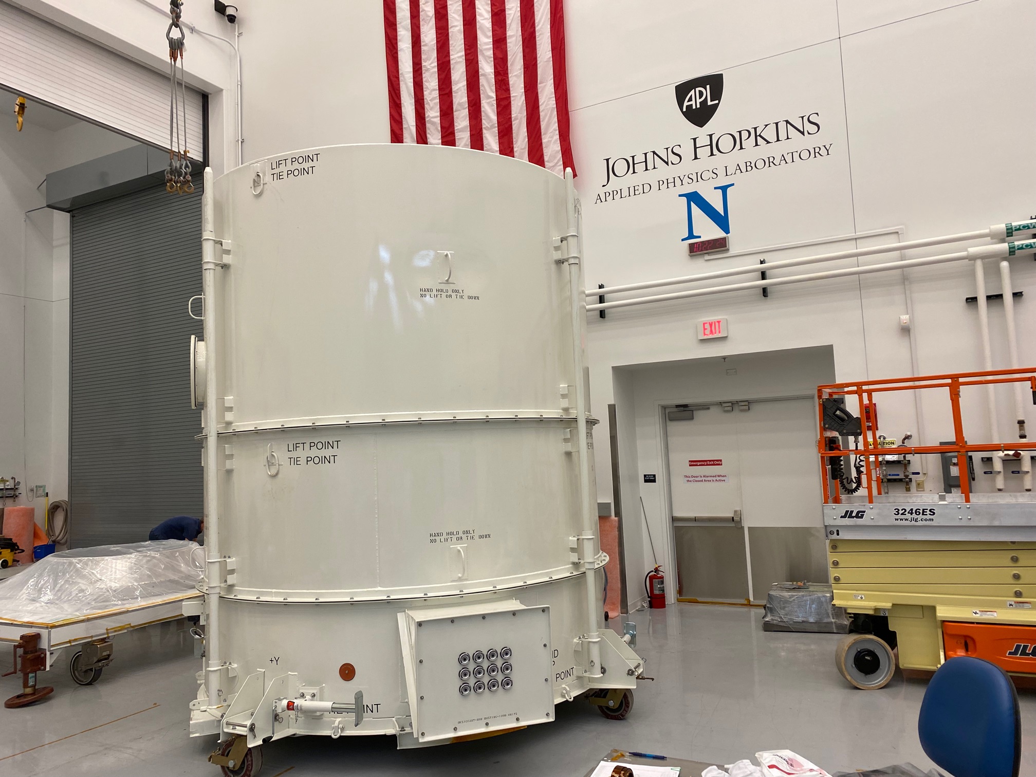 Europa Clipper's propulsion module arrives in its shipping container in the cleanroom