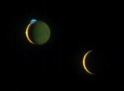 color view of two crescent moons in dark space