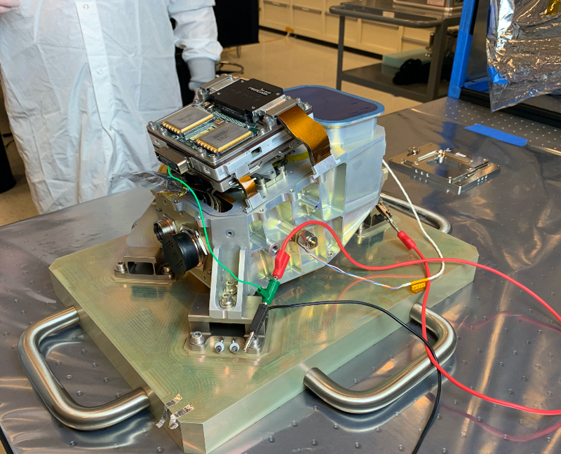 The flight model of Europa Clipper’s thermal camera is shown during a fit-check, in which technicians ensure the instrument’s various components fit together properly. The test was performed in a clean room at Arizona State University, which is building the instrument and performing initial tests on the hardware. The Europa Thermal Emission Imaging System (E-THEMIS) will use infrared light to distinguish warmer regions on Europa’s surface, where liquid water may be near the surface or might have erupted onto the surface. E-THEMIS will also measure surface texture to understand the small-scale properties of Europa’s surface.