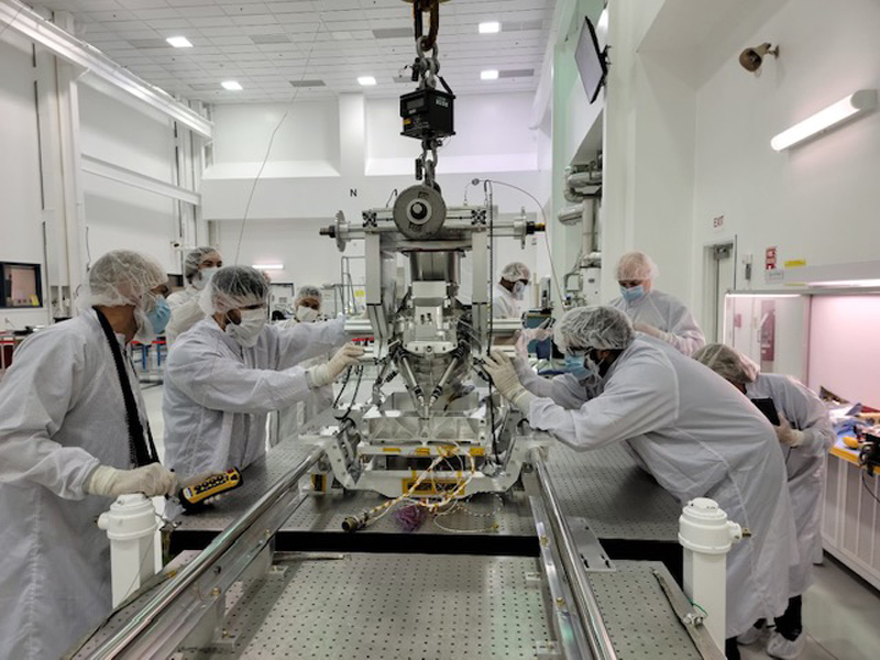 Engineers and technicians work on the flight model of Europa Clipper’s Mapping Imaging Spectrometer for Europa (MISE) instrument in a cleanroom at NASA’s Jet Propulsion Laboratory (JPL) in Southern California. The instrument’s housing and some other components were manufactured in machine shops at JPL, where the instrument is being built and tested. Some of the spacecraft’s other science instruments and hardware are being built and tested at partner institutions around the U.S. and abroad. As with Europa Clipper’s other science instruments, MISE was designed specifically to help determine if Jupiter’s ice-covered moon Europa is habitable.
